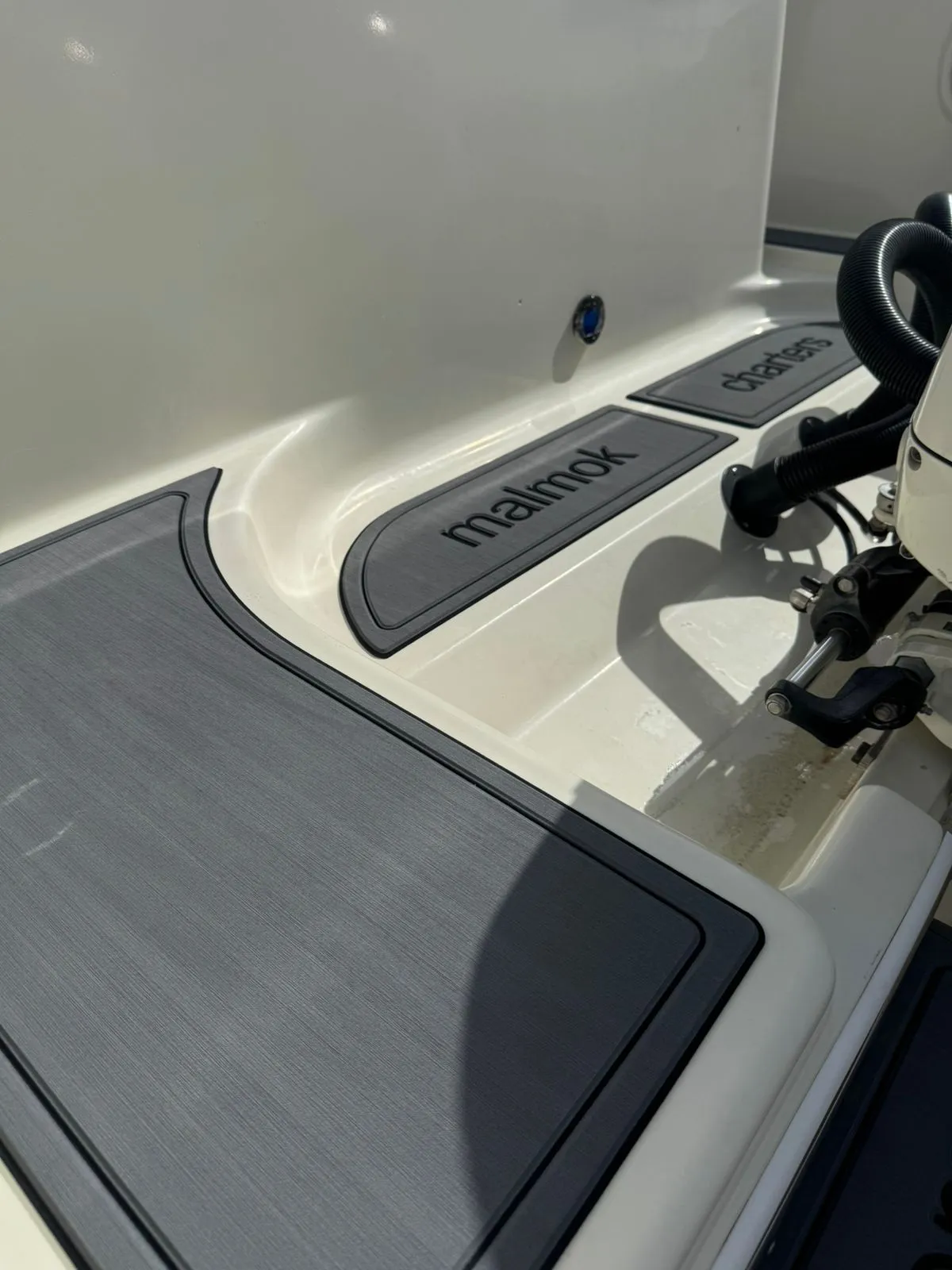 Malmok Charters branded boat mats with engraved logo
